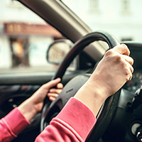 Hands on steering wheel.