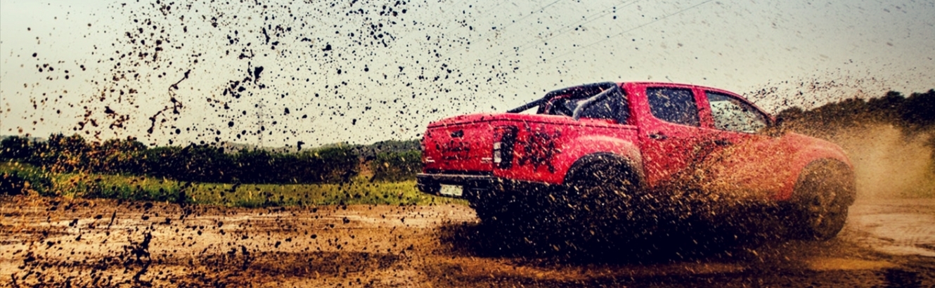 Truck driving through mud.