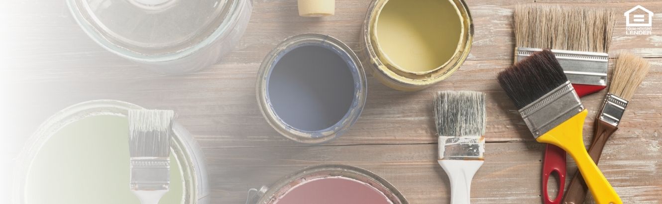 Group of different colored paint cans with paint brushes.
