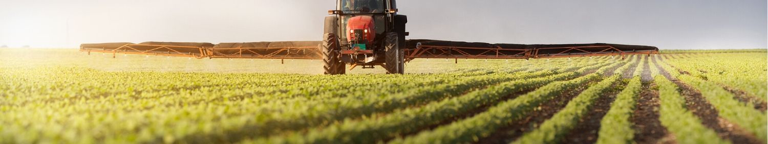 Farmer spraying a field