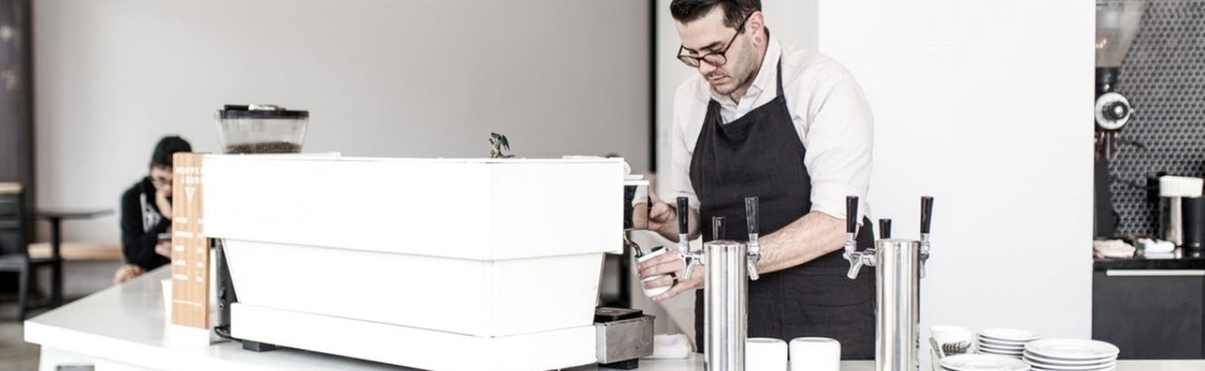 Barista serving coffee.