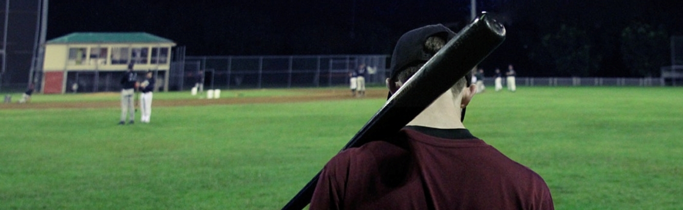 Baseball player with a bat on his shoulder.