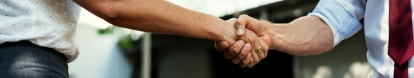 Two people shaking hands.