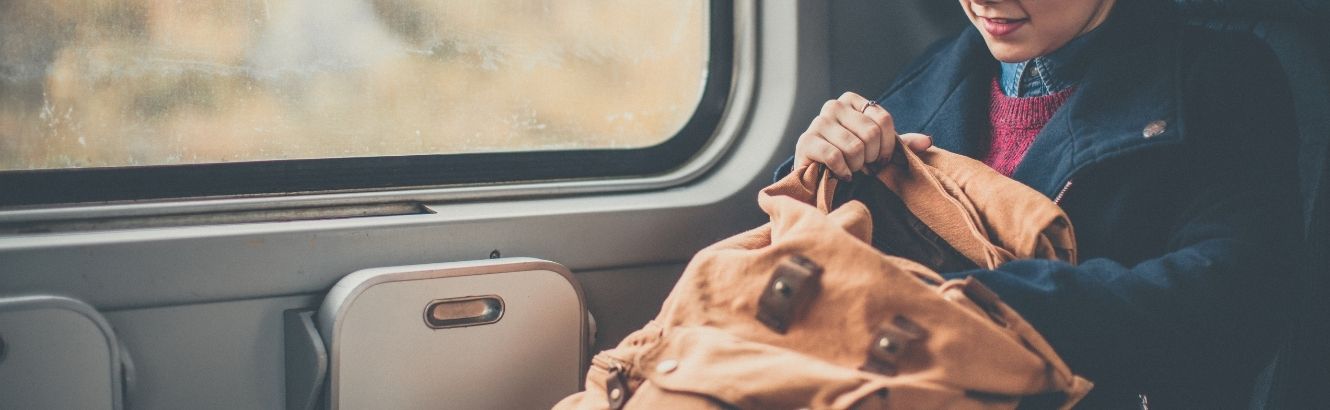 Woman searching through her purse.